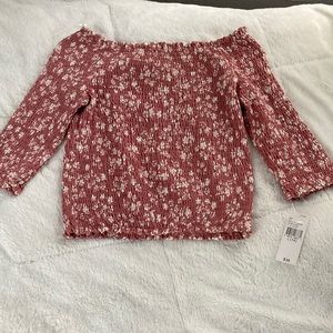 Medium pink tube top with flower pattern.